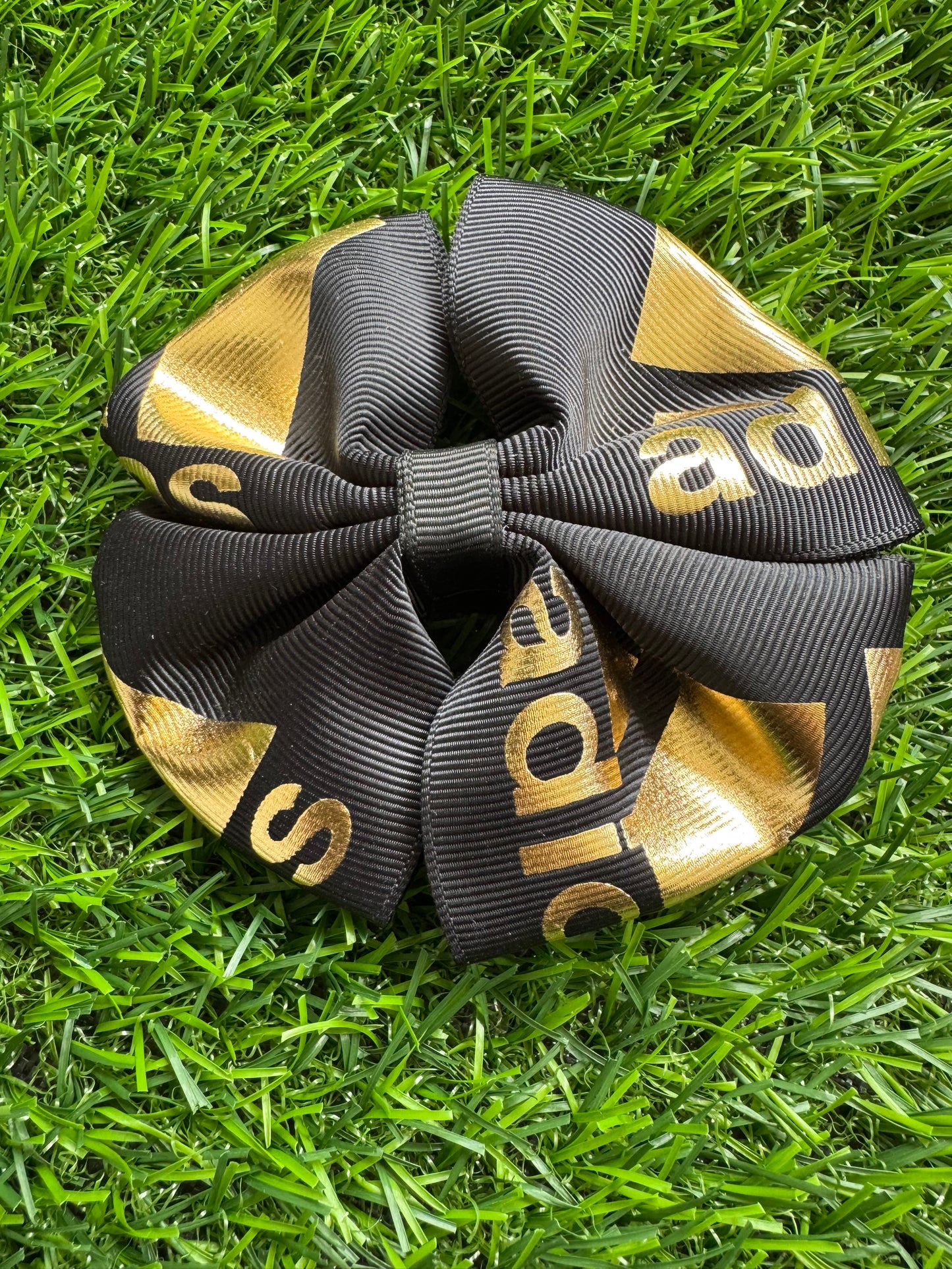 A Did As gold on black